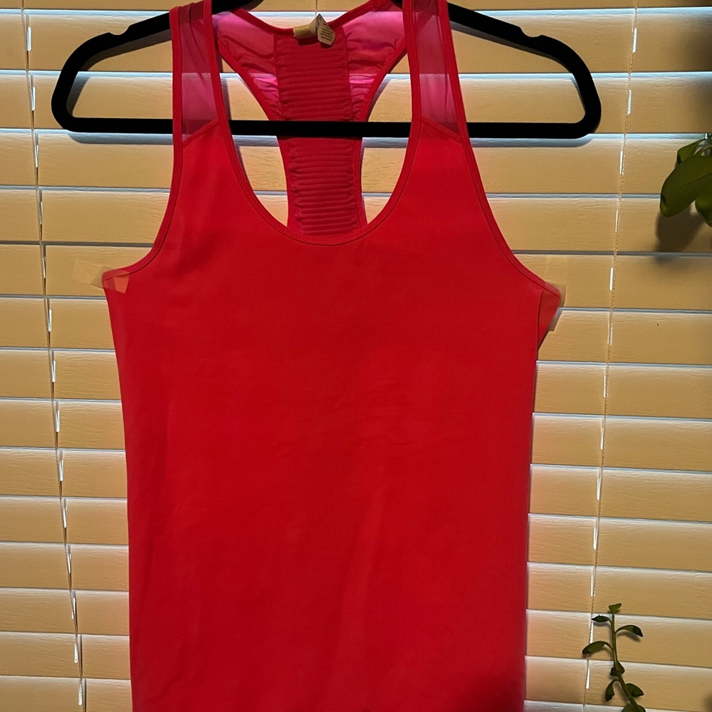 Gently used athleta tank top.  Very cute mesh back.  No pills, no pilling